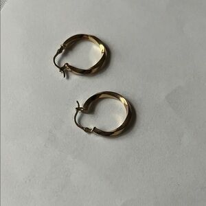 14kt Gold Twisted Hoop Earrings  
.89 ctw
Stamped 14 Kt on closure